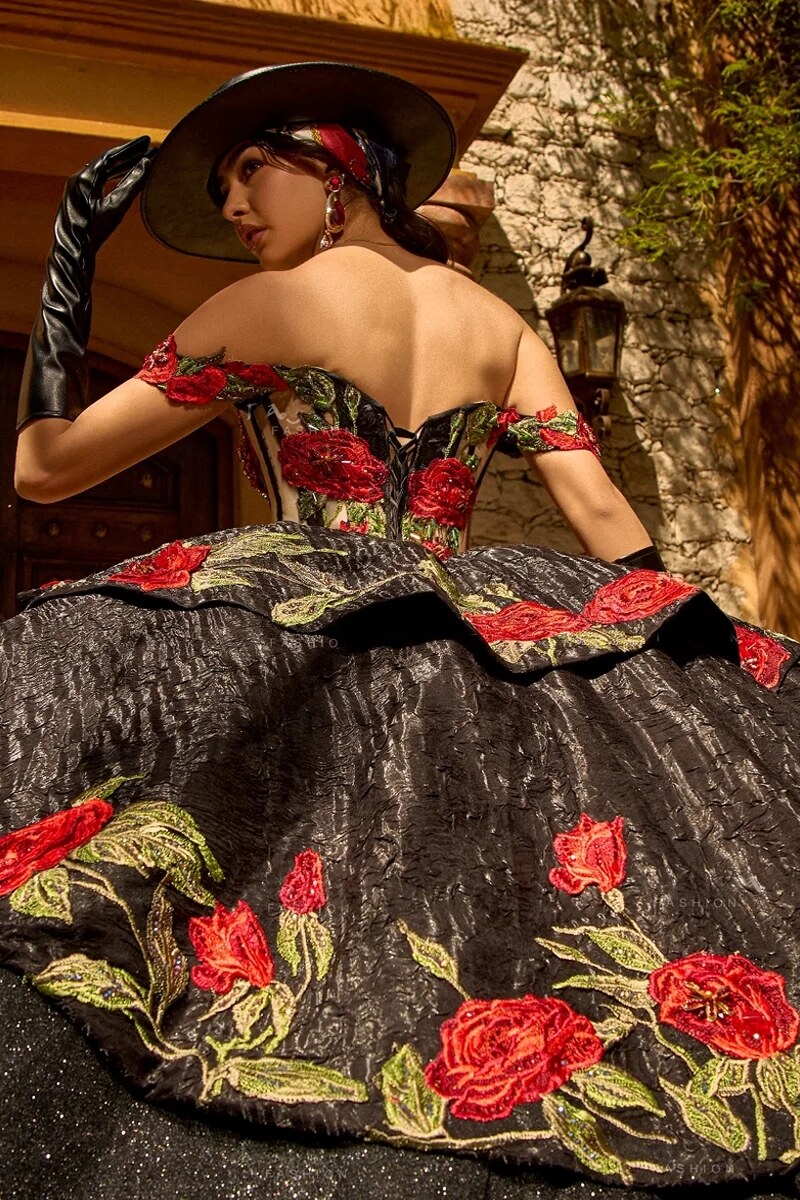 Quinceanera in elegant black and red embroidered gown